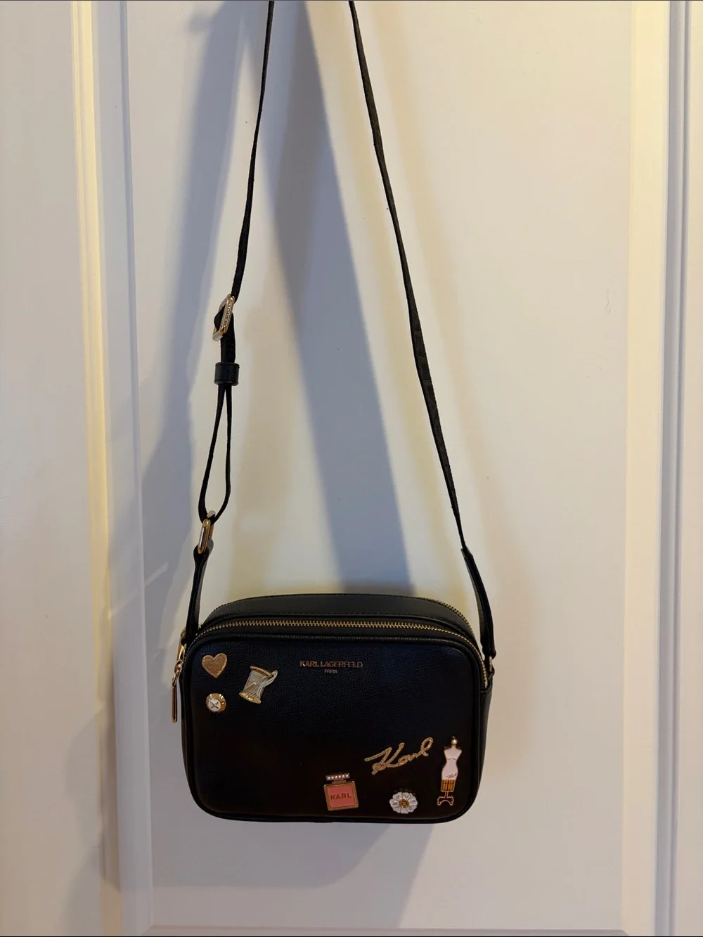 Karl Lagerfeld Black Crossbody Camera Bag with Gold & Pink Charm Accents